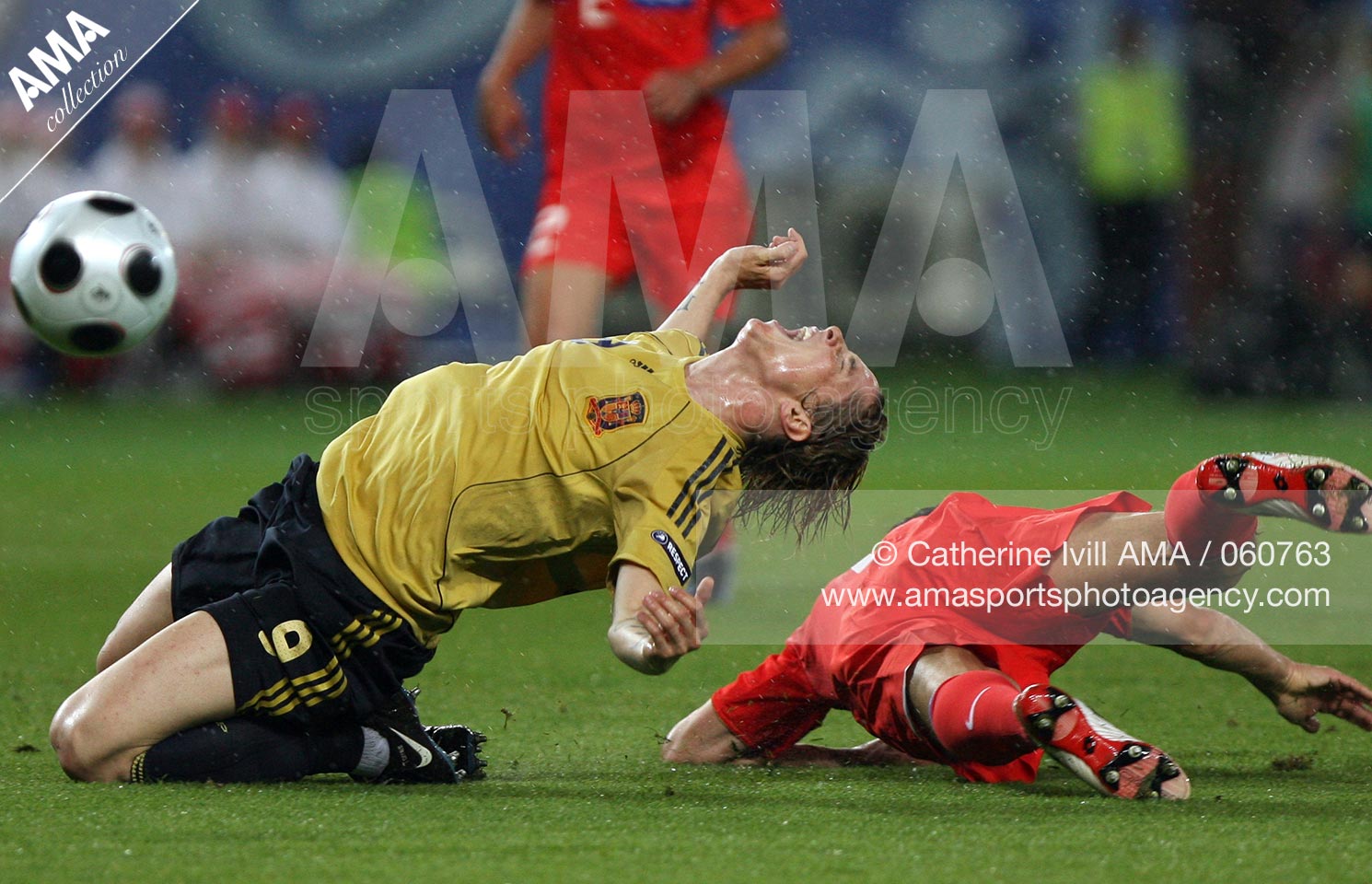 26 June 2008 - Euro 2008 - Semi-final - Russia v Spain - Fernando Torres of Spain is tripped by Sergei Ignashevich of Russia